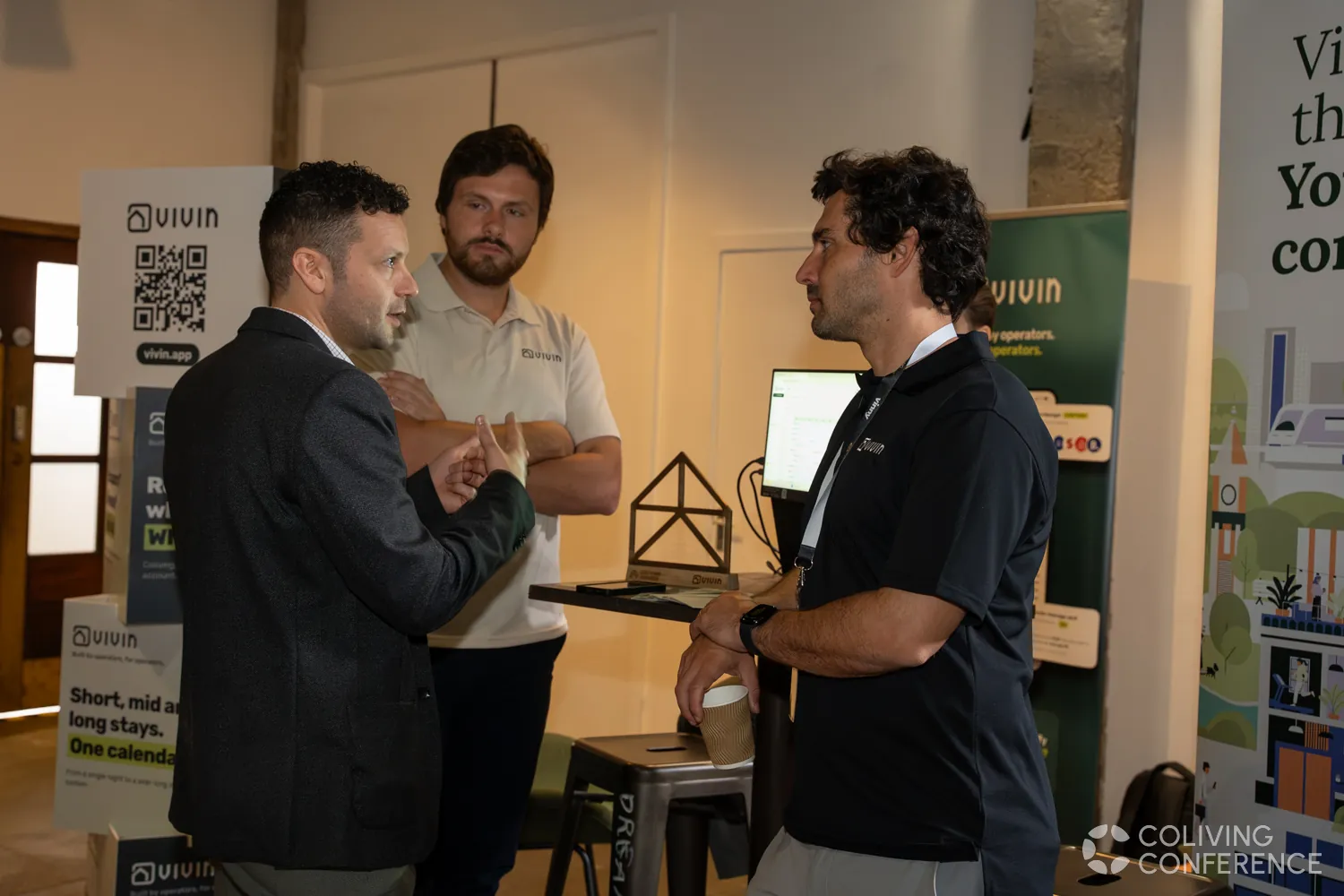 The Vivin team at its stand, with the trophy